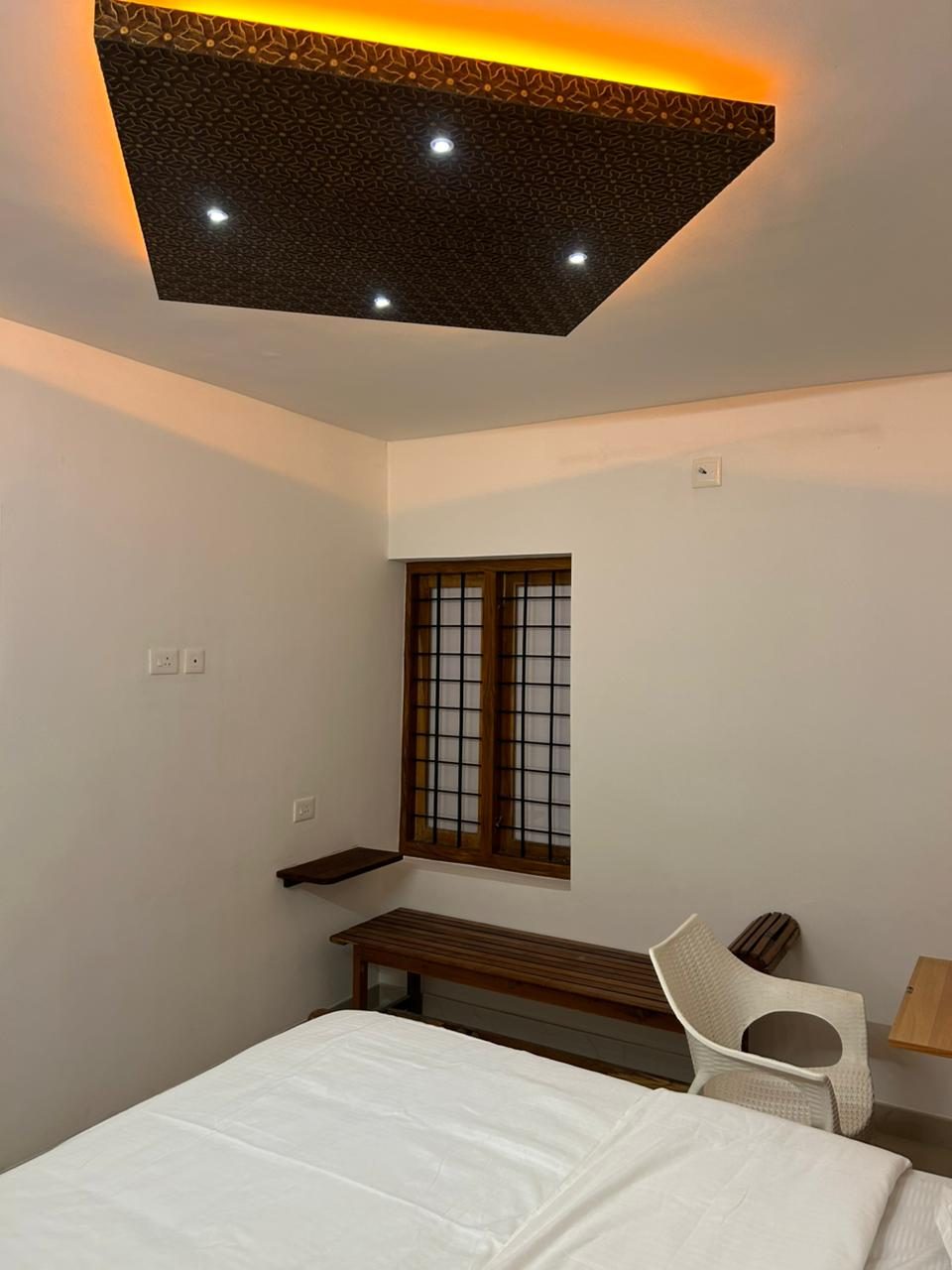 Bedroom with bench seating and window at Mountain Breeze